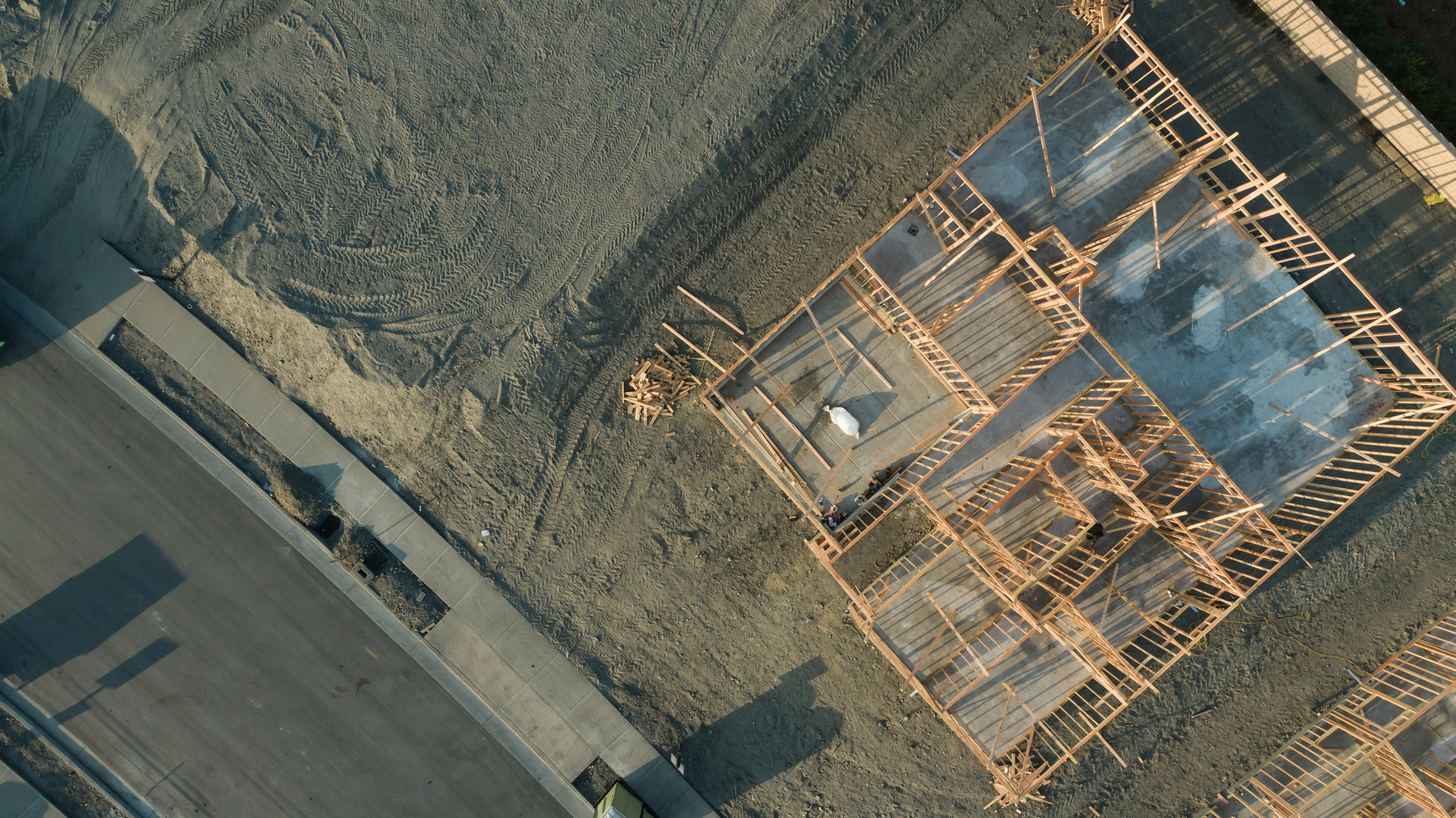 Drone Aerial View of Home Construction Site Foundations and Fram